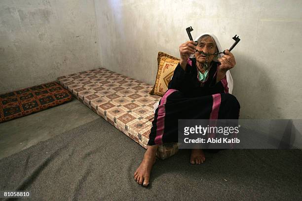 Al-SHATI REFUGEE CAMP-GAZA CITY, GAZA STRIP A hundred and one year Old Palestinian refugee Rahma Ali Abed shows her old house keys from her former...
