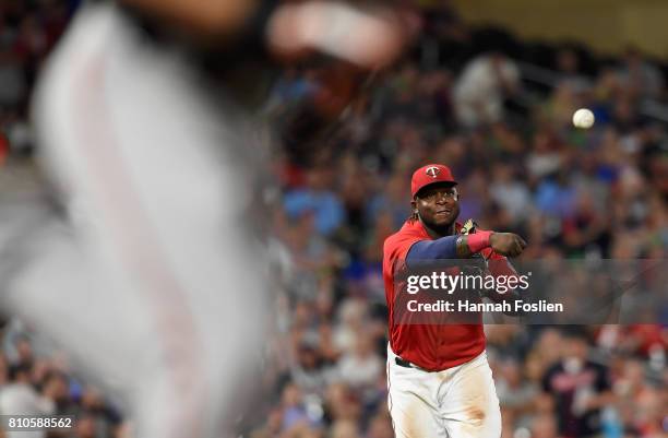 Miguel Sano of the Minnesota Twins throws to first base to get out Joey Rickard of the Baltimore Orioles during the eighth inning of the game on July...