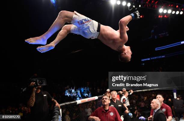 Justin Gaethje celebrates by doing a backflip off the Octagon after defeating Michael Johnson in their lightweight bout during The Ultimate Fighter...