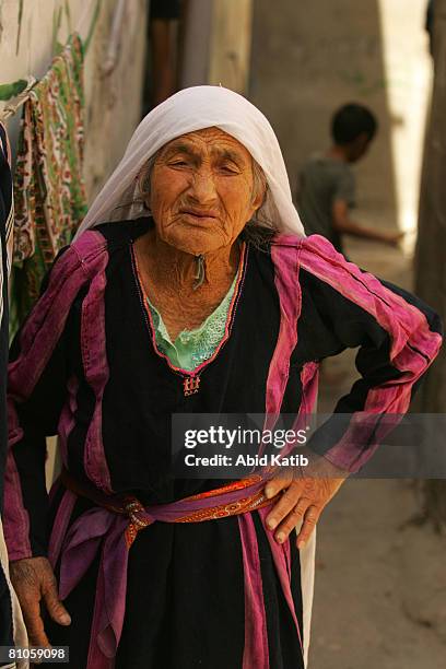 Al-SHATI REFUGEE CAMP-GAZA CITY, GAZA STRIP A hundred and one year Old Palestinian refugee Rahma Ali Abed walks down an alleyway near her home in the...