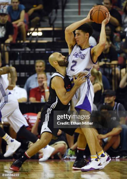 Lonzo Ball the Los Angeles Lakers is guarded by Kendall Marshall of the Los Angeles Clippers during the 2017 Summer League at the Thomas & Mack...