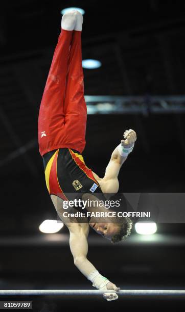 Germany's Fabian Hambuechen competes on the horizontal bar during the 28th European Men's Artistic Gymnastics Championships on May 10, 2008 at Malley...