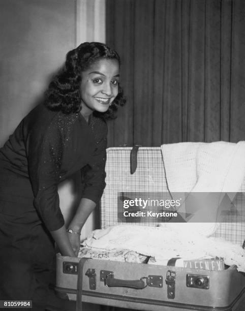 Trinidad-born singer Mona Baptiste prepares to leave Hamburg for a visit to London, 13th September 1956.