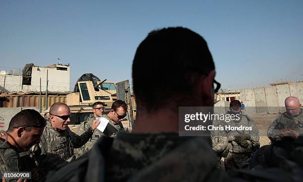 Army Chaplain Jonathan Knoedler of Portland, Oregon leads men of the 3-89 Cavalry Regiment of the 10th Mountain Division in prayer before moving out...