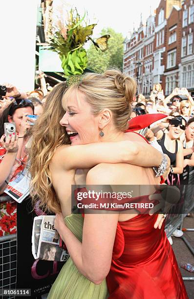 Actress Sarah Jessica Parker embraces Kim Catrall as they attend the World Premiere of 'Sex And The City' held at the Odeon Leicester Square on May...