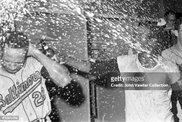 Frank Robinson and Paul Blair of the Baltimore Orioles celebrate clinching the American League pennant in the clubhouse after a game on September 22,...