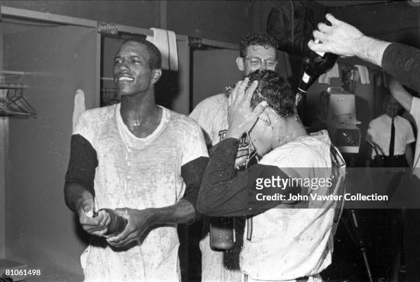 Paul Blair, Gene Brabender and Luis Aparicio the Baltimore Orioles celebrate clinching the American League pennant in the clubhouse after a game on...