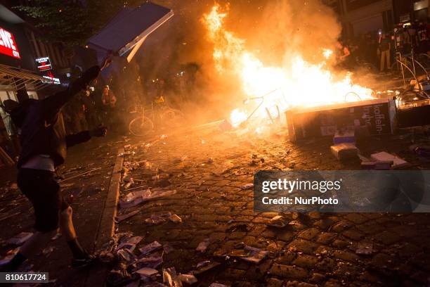 Man set a fire during riots in St. Pauli district during G 20 summit in Hamburg on July 8, 2017 . Authorities are braced for large-scale and...