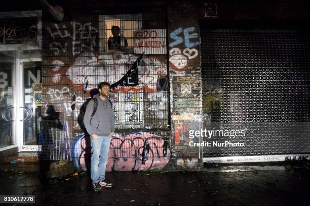 Man stay in spotlight during riots in St. Pauli district during G 20 summit in Hamburg on July 8, 2017 . Authorities are braced for large-scale and...