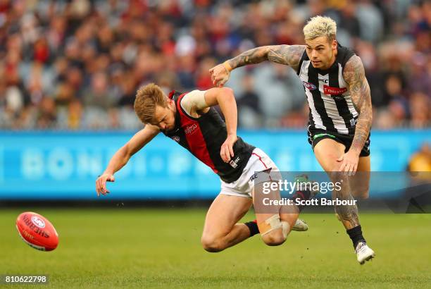 Martin Gleeson of the Bombers and Jamie Elliott of the Magpies compete for the ball during the round 16 AFL match between the Collingwood Magpies and...