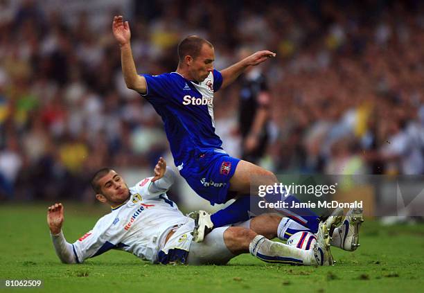 Bradley Johnson of Leeds tackles Marc Bridge Wilkinson of Carlisle during the League 1 Playoff Semi Final, 1st Leg match between Leeds United and...