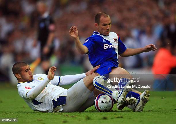 Bradley Johnson of Leeds tackles Marc Bridge Wilkinson of Carlisle during the League 1 Playoff Semi Final, 1st Leg match between Leeds United and...