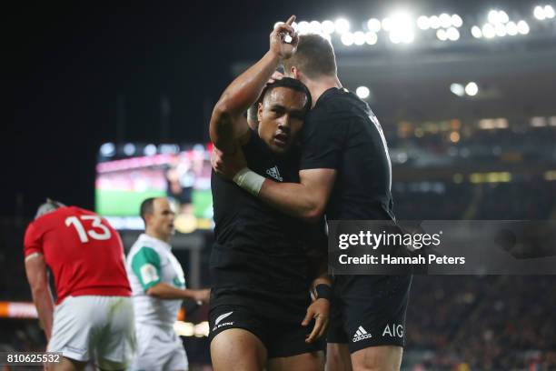 Ngani Laumape of the All Blacks is congratulated by teammate Jordie Barrett of the All Blacks after scoring the opening try during the third test...