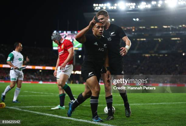 Ngani Laumape of the All Blacks is congratulated by teammate Jordie Barrett of the All Blacks after scoring the opening try during the third test...