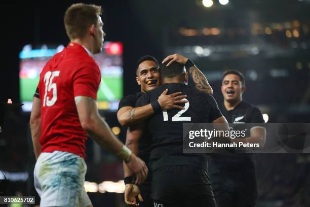 Ngani Laumape#12 of the All Blacks is congratulated by teammates after scoring the opening try during the third test match between the New Zealand...