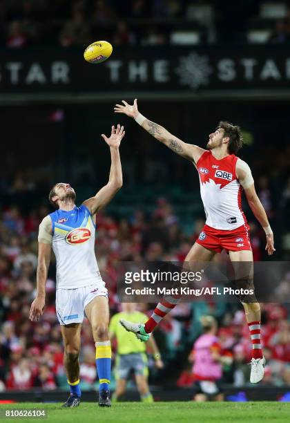 Jarrod Witts of the Suns competes for the ball against Sam Naismith of the Swans during the round 16 AFL match between the Sydney Swans and the Gold...
