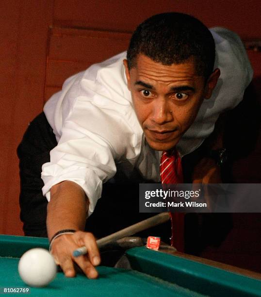 Democratic presidential hopeful Sen. Barack Obama plays a game of pool during a stop at Schultzie's Bar & Hot Spot May 12, 2008 in Springhill, West...