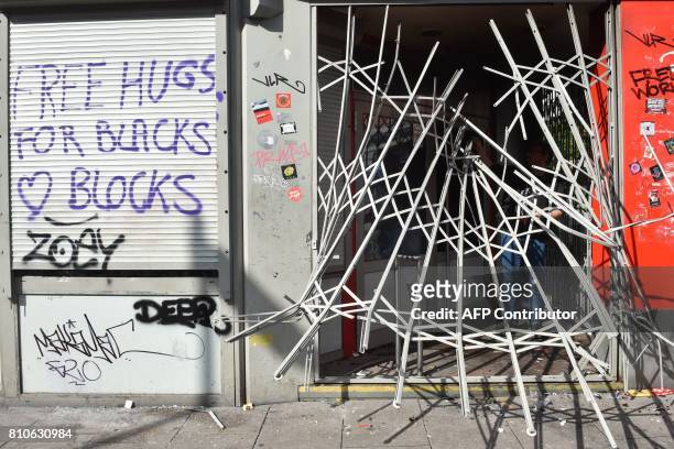 Destroyed fence is seen after riots in Hamburg's Schanzenviertel district on July 8, 2017 in Hamburg, northern Germany, where leaders of the world's...