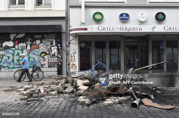 Debris lay in the street after riots in Hamburg's Schanzenviertel district on July 8, 2017 in Hamburg, northern Germany, where leaders of the world's...