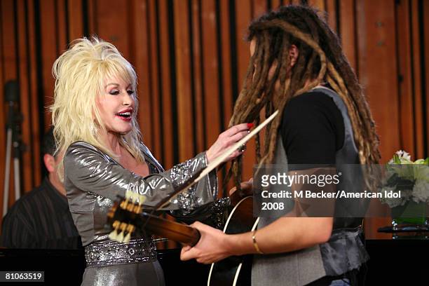 American Idol contestant Jason Castro rehearses in the studio with country singer Dolly Parton on March 29, 2008 in Los Angeles, California.