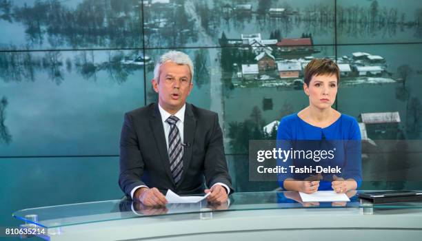 newsreader couple in television studio - weather forecaster stock pictures, royalty-free photos & images