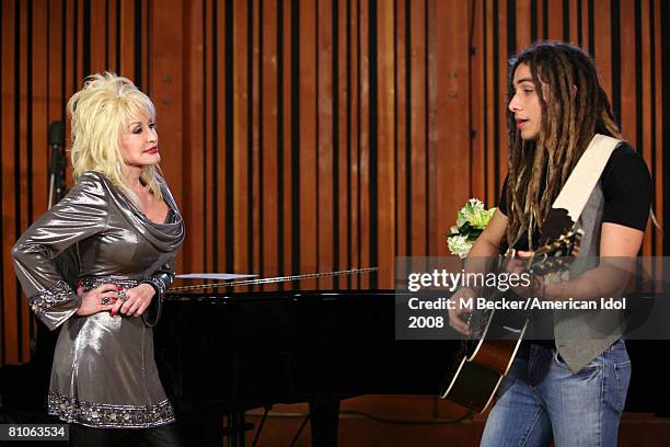 American Idol contestant Jason Castro rehearses in the studio with country singer Dolly Parton on March 29, 2008 in Los Angeles, California.