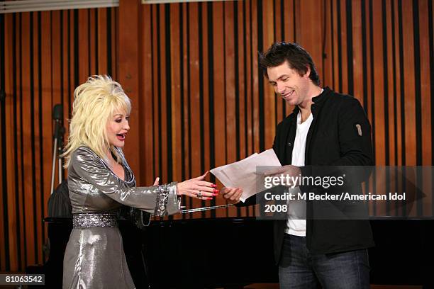 American Idol contestant Michael Johns rehearses in the studio with country singer Dolly Parton on March 29, 2008 in Los Angeles, California.