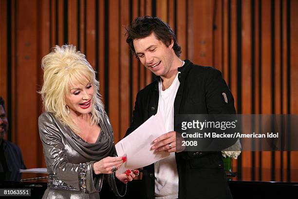 American Idol contestant Michael Johns rehearses in the studio with country singer Dolly Parton on March 29, 2008 in Los Angeles, California.