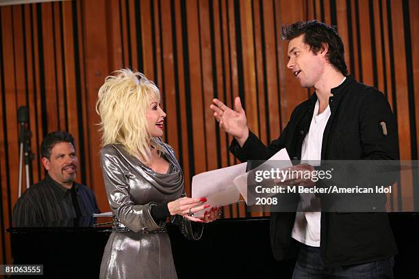 American Idol contestant Michael Johns rehearses in the studio with country singer Dolly Parton on March 29, 2008 in Los Angeles, California.