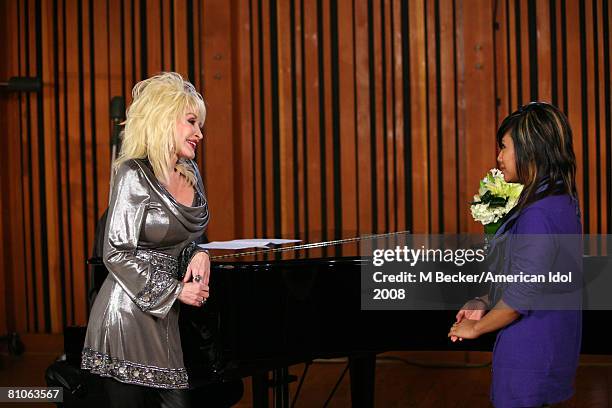 American Idol contestant Ramiele Malubay rehearses in the studio with country singer Dolly Parton on March 29, 2008 in Los Angeles, California.