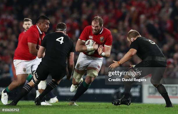 Alun Wyn Jones of the Lions charges towards Brodie Retallick and Owen Franks of the All Blacks during the third test match between the New Zealand...