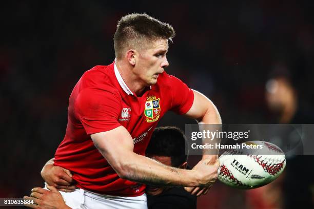 Owen Farrell of the Lions offloads the ball during the Test match between the New Zealand All Blacks and the British & Irish Lions at Eden Park on...