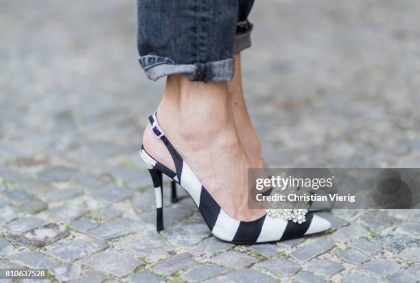 Alexandra Lapp wearing a T-Shirt from H&M, printed with The Revolution Is Female, a high waist, non-strech denim, five-pocket 501 skinny jeans from...
