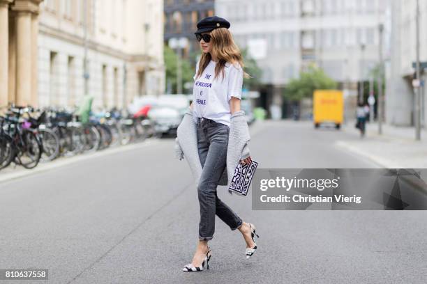 Alexandra Lapp wearing a T-Shirt from H&M, printed with The Revolution Is Female, a high waist, non-strech denim, five-pocket 501 skinny jeans from...