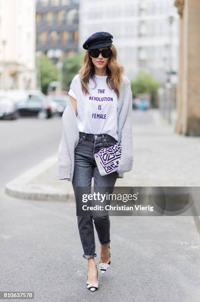 Alexandra Lapp wearing a T-Shirt from H&M, printed with The Revolution Is Female, a high waist, non-strech denim, five-pocket 501 skinny jeans from...
