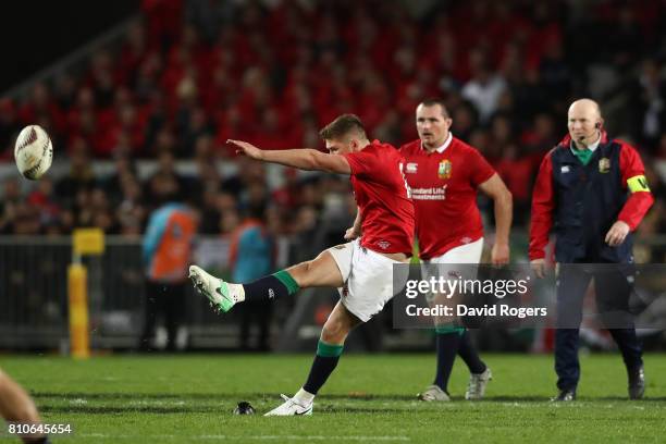 Owen Farrell of the Lions kicks a long range penalty to level the scores at 15-15 during the third test match between the New Zealand All Blacks and...