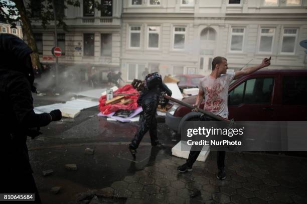 Riot police use water cannons during protests in Hamburg's Schanzenviertel district during the G20 summit in Hamburg, Germany, on July 7, 2017.