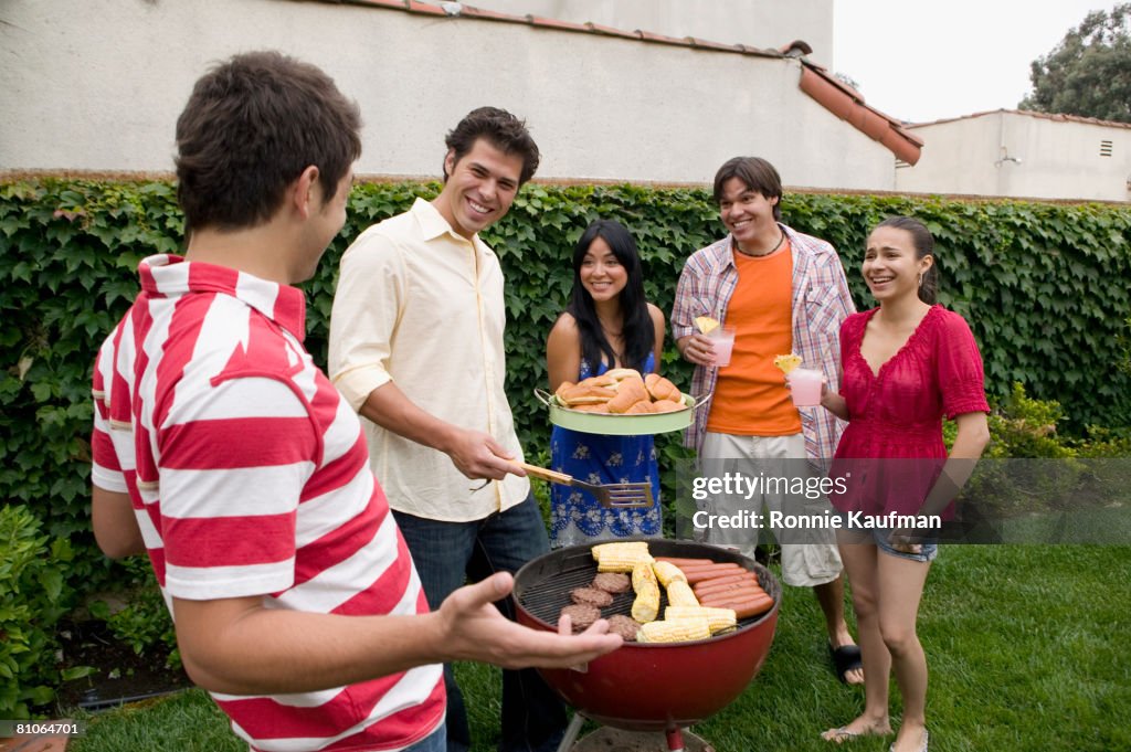 Hispanic friends having barbecue