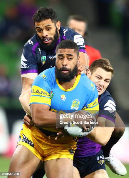 Michael Jennings of the Eels is tackled during the round 18 NRL match between the Melbourne Storm and the Parramatta Eels at AAMI Park on July 8,...