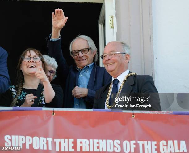 Film director Ken Loach waves to crowds as he watches colliery bands pass below the County Hotel balcony during the 133rd Durham Miners Gala on July...