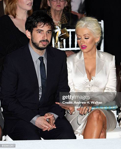Christina Aguilera and her husband Jordan Bratman attend the Christian Dior Cruise 2009 Collection at Gustavino's in New York City.