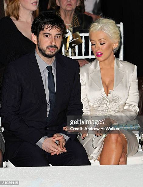 Singer Christina Aguilera and her husband Jordan Bratman attend the Christian Dior Cruise 2009 Collection at Gustavino's in New York City.