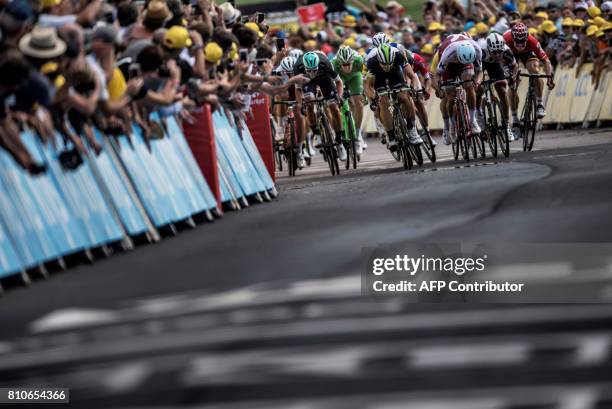 Riders sprint towards the finish line at the end of the 213,5 km seventh stage of the 104th edition of the Tour de France cycling race on July 7,...