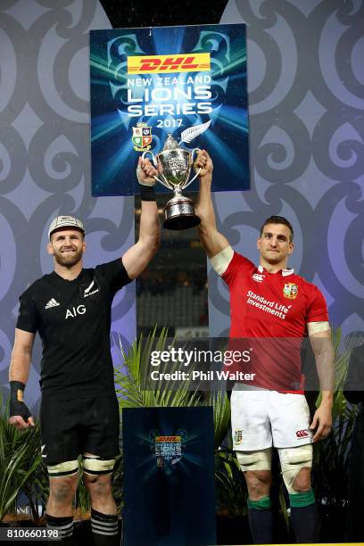 All Black captain Kieran Read and Lions captain Sam Warburton pose with the series trophy following the drawn Test match between the New Zealand All...