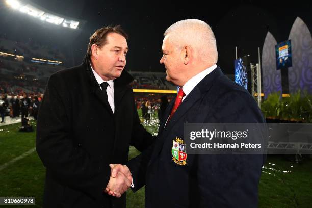 Head coach Steve Hansen shakes hands with head coach Warren Gatland of the Lions the Test match between the New Zealand All Blacks and the British &...