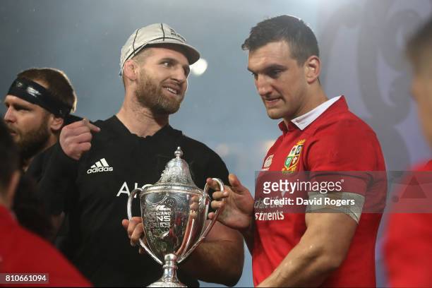 Opposing captains Kieran Read of the All Blacks and Sam Warburton of the Lions lift the trophy following a drawn series during the third test match...