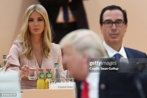 Ivanka Trump and U.S. Treasury Secretary Steven Mnuchin look on as U.S. President Donald Trump arrives for the morning working session on the second...