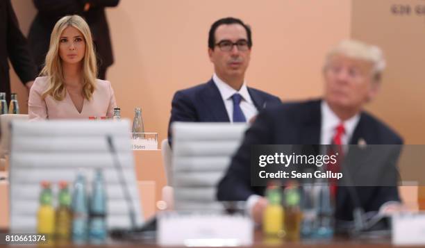 Ivanka Trump and U.S. Treasury Secretary Steven Mnuchin look on as U.S. President Donald Trump arrives for the morning working session on the second...