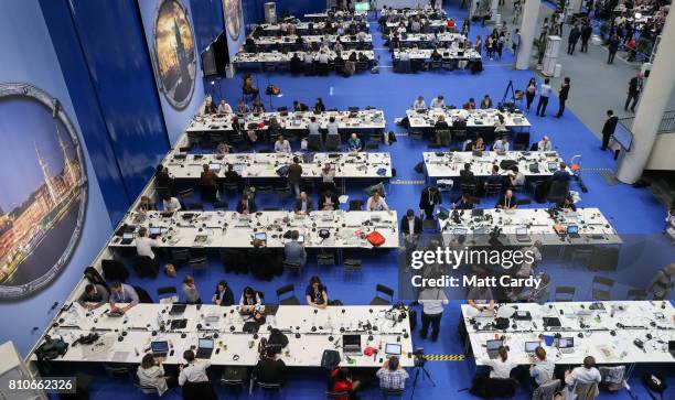 Journalists work in the media area of the venue for the G20 summit on July 7, 2017 in Hamburg, Germany. Leaders of the G20 group of nations are...