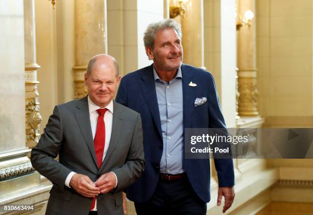 First Mayor of Hamburg Olaf Scholz welcomes Xavier Giocanti , partner of International Monetary Fund managing director Christine Lagarde, at the...